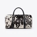 Cowhide Hair-On Leather Weekender Duffle Bag crafted from genuine leather with a natural hair-on cowhide finish, spacious travel compartment, sturdy carry handles, and an adjustable shoulder strap for weekend trips and everyday travel.