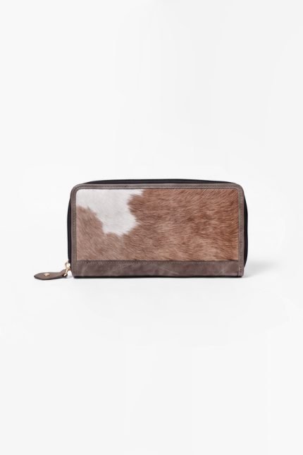 Genuine hair-on cowhide leather wallet with a natural black and white pattern and zipper closure.