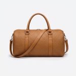 Luxury woven leather weekender bag in classic tan, handcrafted from premium genuine leather with a handwoven texture, spacious zippered compartment, dual carry handles, adjustable shoulder strap, and airline-friendly carry-on design for men and women.